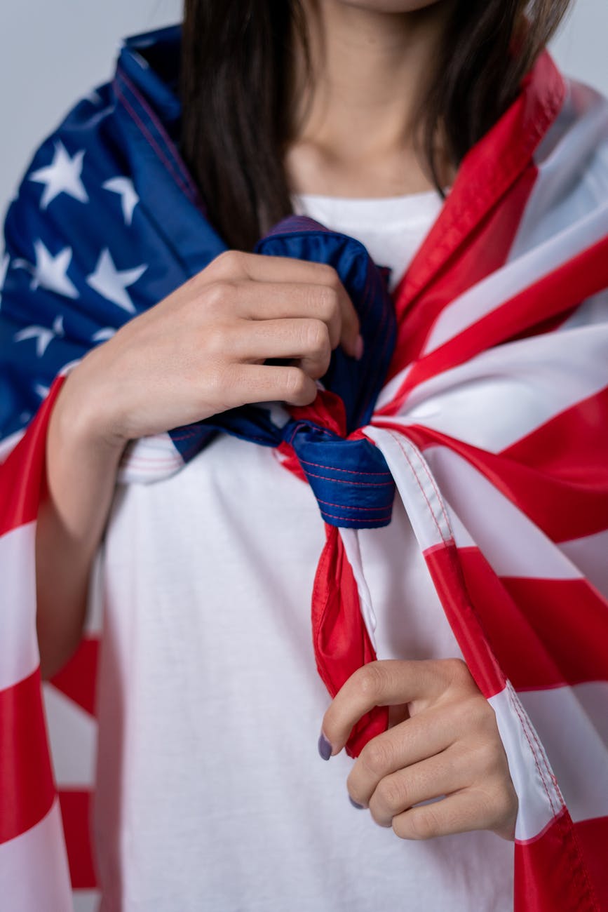woman holding red and blue star print textile